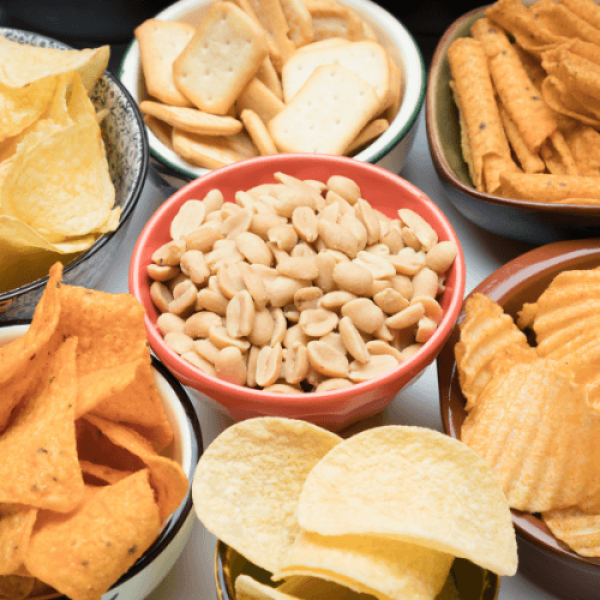 Photo of snacks - chips and nuts on a table