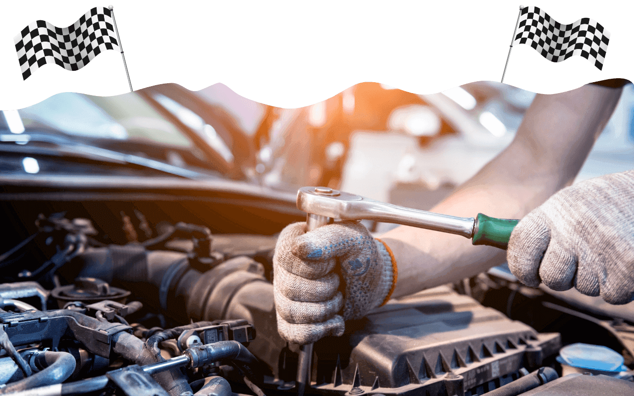 Mechanic working on car with checkered flags