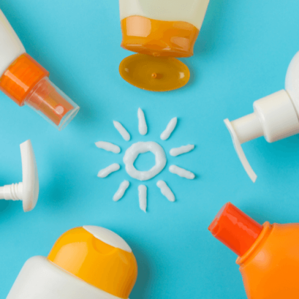 Sunscreen on blue background with little sun in the middle