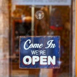 Come in we're open sign on door